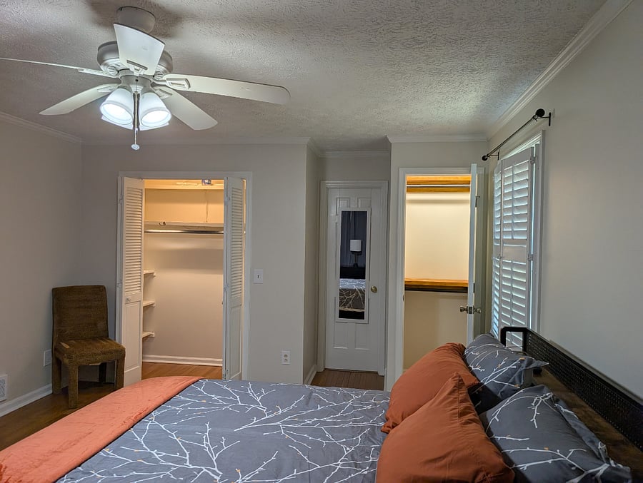Private space, Unit #1: Lots of closet space in these two closets. The ensuite bath is accessed through the center door.