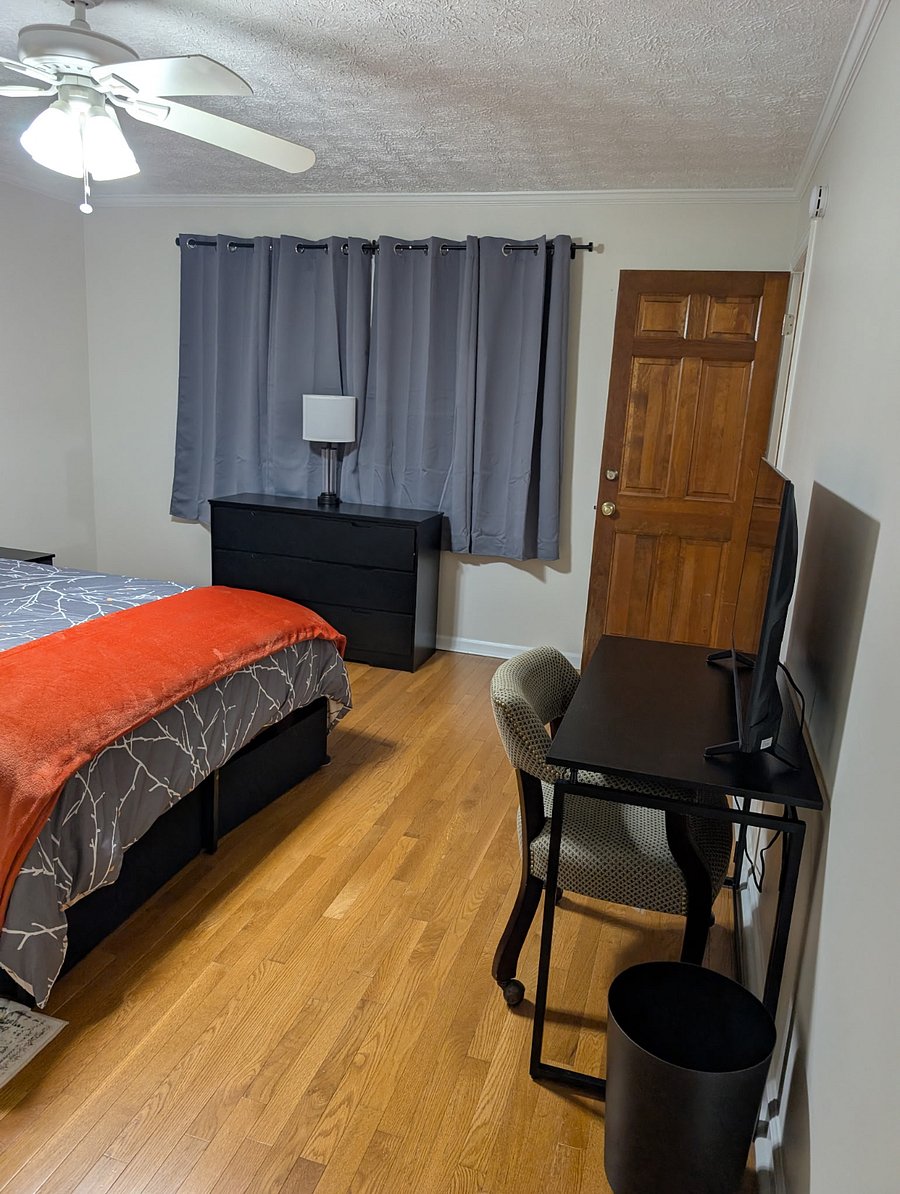 Private space, Unit #1: Dresser provides even more storage space. A desk and chair are along the right wall.