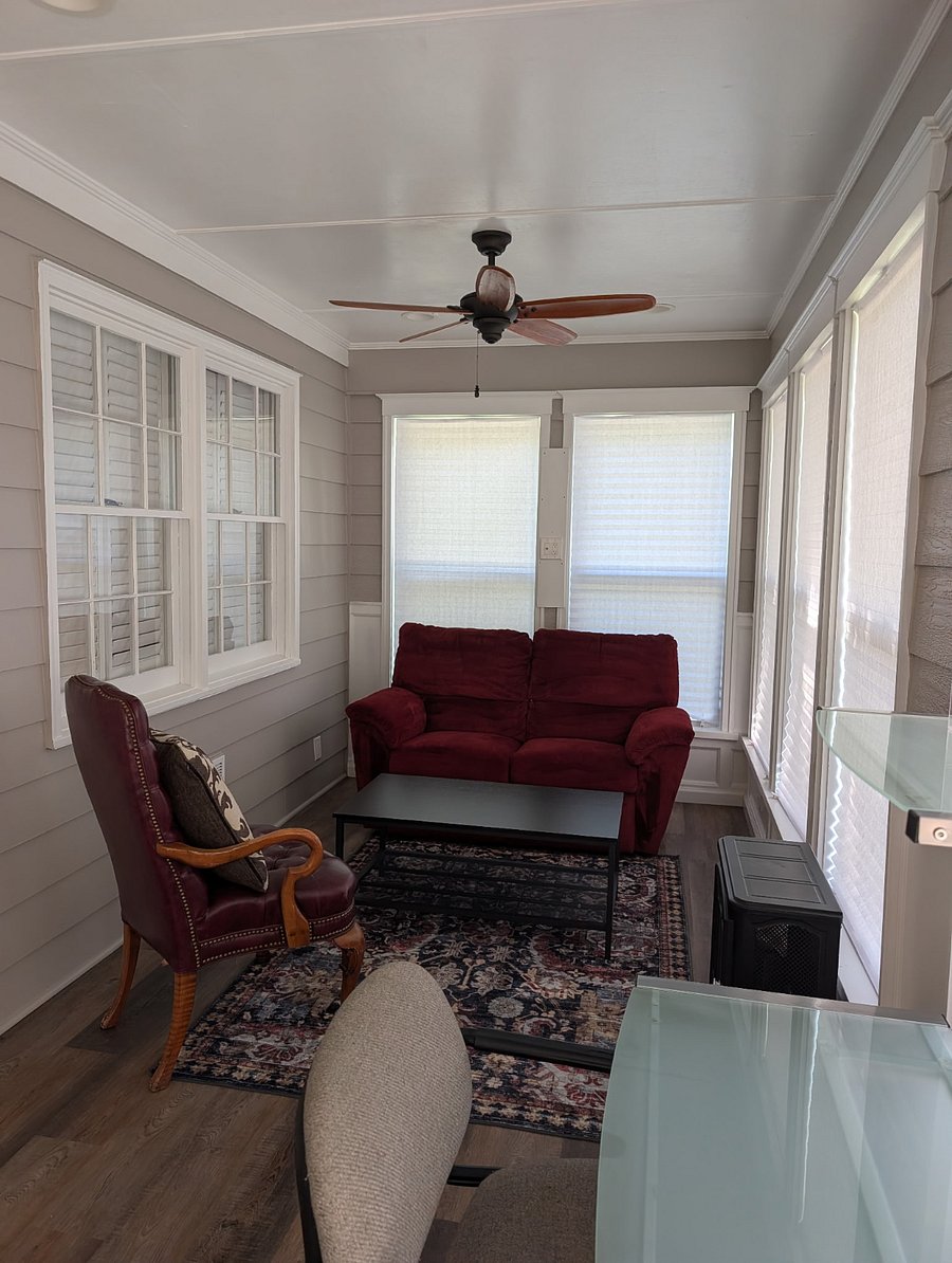 Private space, Unit #1: The front sunroom is a nice spot to sit and relax, or to use as an office.