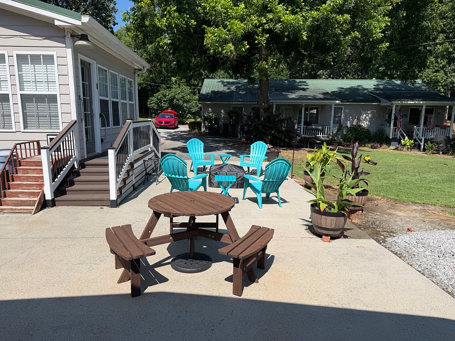 COMMON AREA: The patio includes a round picnic table. Not shown is the 9 umbrella to shade the table.
