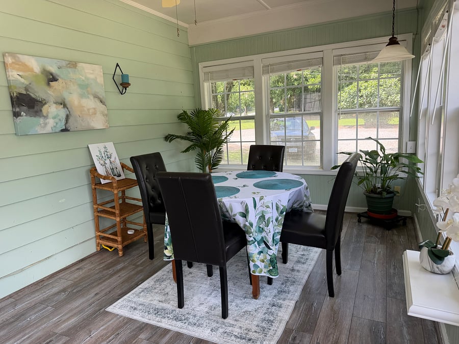 Sunny shared dining room adds cheer to every meal.