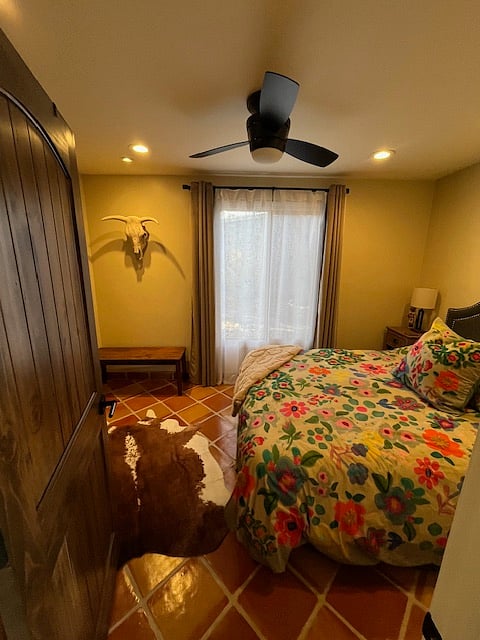 Second bedroom with a queen bed and a full closet