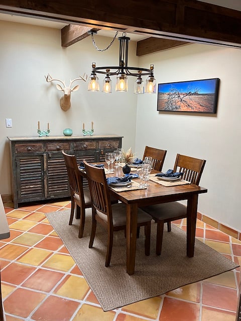Full dining room with goblets and place settings to dine in luxury