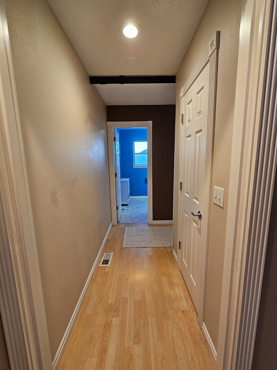 Hallway from master bedroom to half bathroom