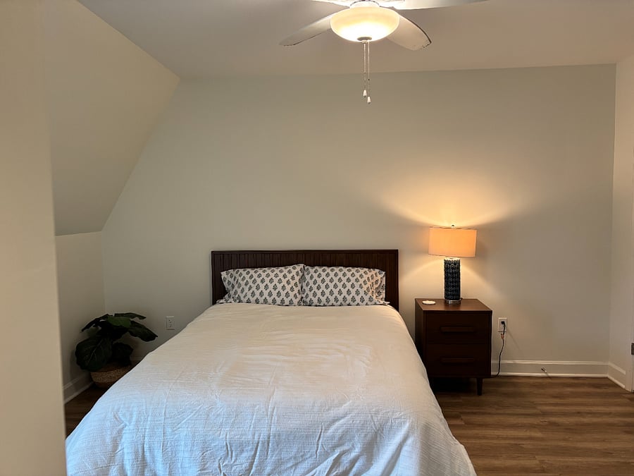Sleep in comfort in a Queen size Burrow platform bed with a new Tuft and Needle mattress and quality cotton bedding. Enjoy your favorite shows on a 32" smart tv mounted across from the bed.