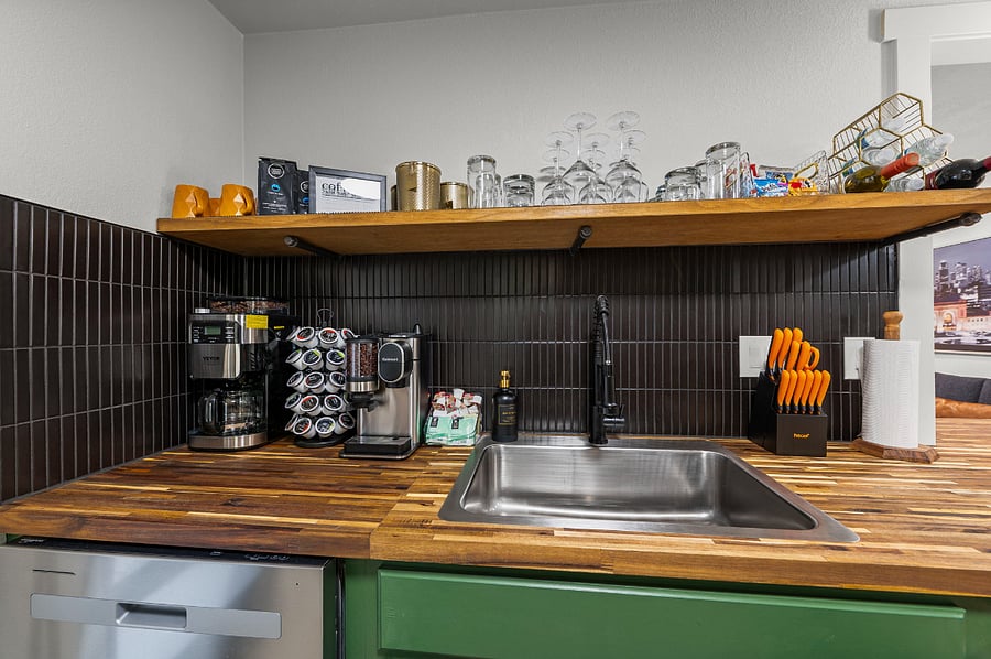 Wake up to your perfect cup with a coffee station that gives you options. Brew a full pot of freshly ground beans, grind by the cup, or pop in a K-Cup. Designed for every preference, its a cozy touch that makes mornings here feel special.