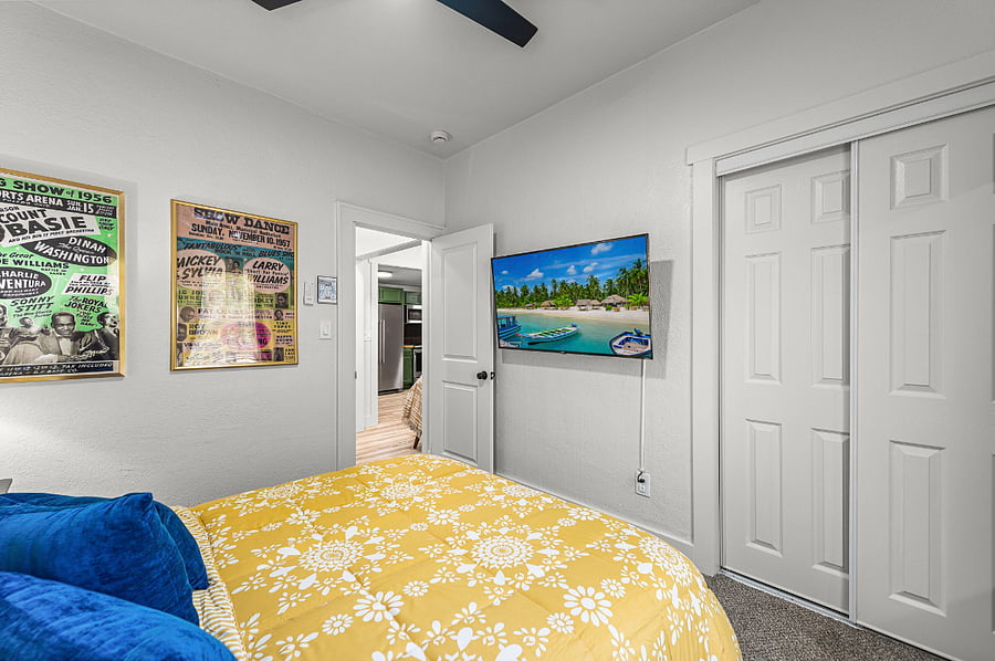 Unwind in a vibrant queen suite honoring KCs jazz history. Enjoy bold dcor, a plush bed, smart TV, and Alexa device. A spacious closet, large mirror, and warm lighting make this stylish retreat perfect for restful nights and inspired mornings.