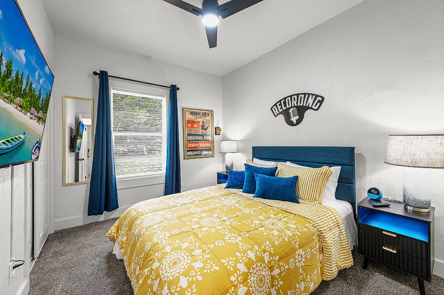 Unwind in a vibrant queen suite honoring KCs jazz history. Enjoy bold dcor, a plush bed, smart TV, and Alexa device. A spacious closet, large mirror, and warm lighting make this stylish retreat perfect for restful nights and inspired mornings.