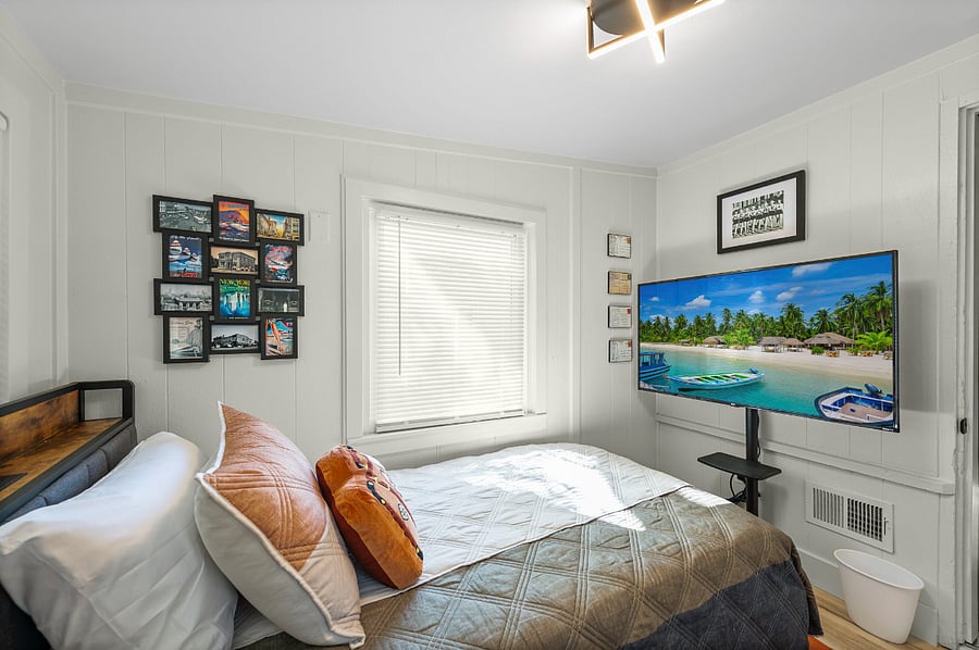 Bright and welcoming, this cozy twin bedroom is filled with natural light and thoughtful touches. Complete with a nightstand, storage, and soft bedding, its the perfect retreat for kids, friends, or solo travelers looking for comfort.
