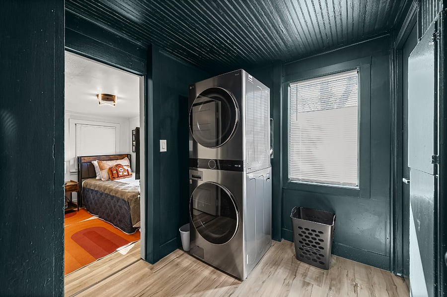 Enjoy the convenience of an in-home washer and dryer, making longer stays and family trips stress-free. Tucked just off the bedroom, this modern laundry space is stocked with essentials so you can pack light and feel right at home.