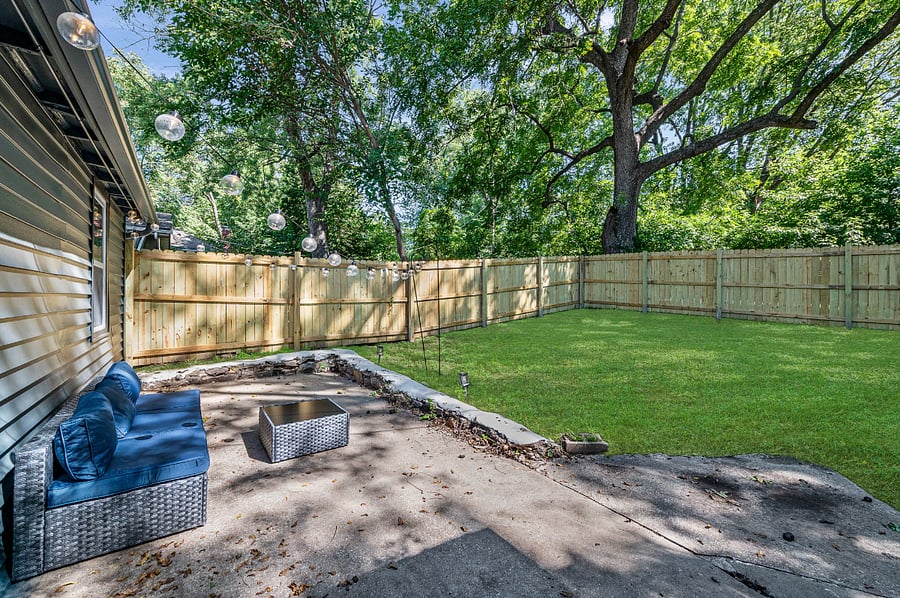 Unwind in your private backyard retreat with string lights, cozy lounge seating, and plenty of space to relax. More outdoor seating is available, making it the perfect spot to gather, sip a drink, or simply enjoy the fresh air. Plenty more seating has been added since this picture. 