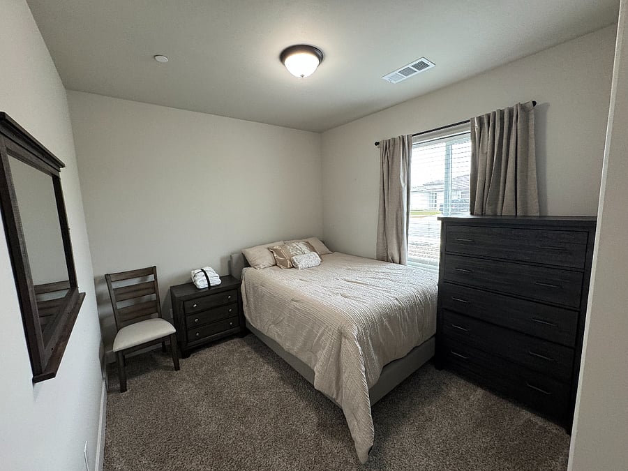 Room A with queen bed and shared bathroom