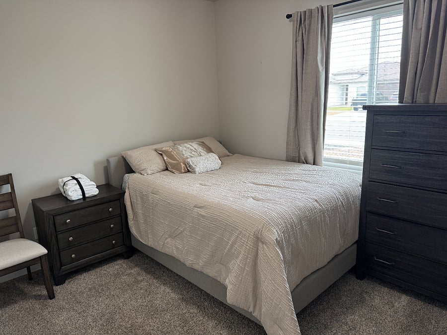 Room A with queen bed and shared bathroom