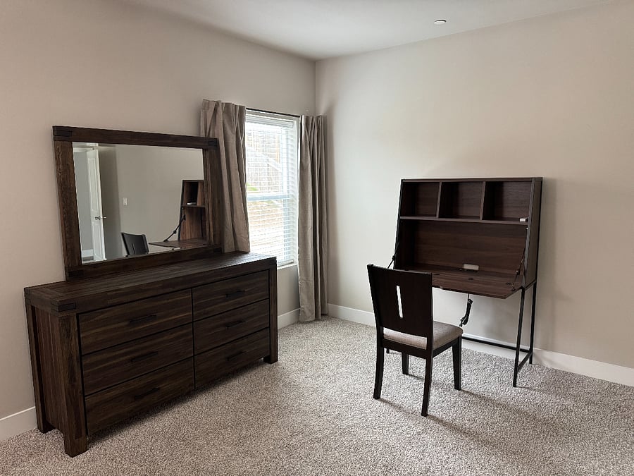 Dresser and large desk included in master bedroom