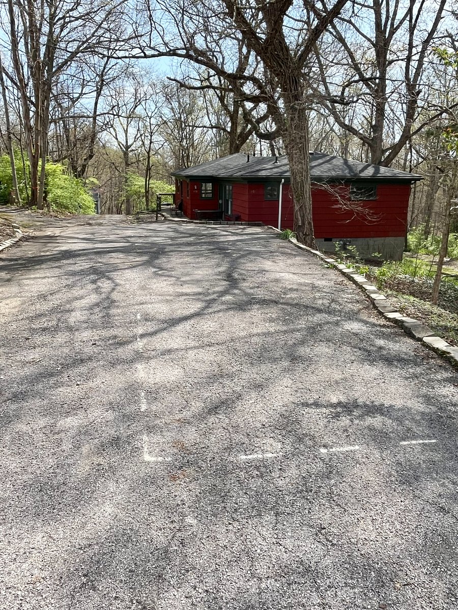 view of house with plentiful off street parking