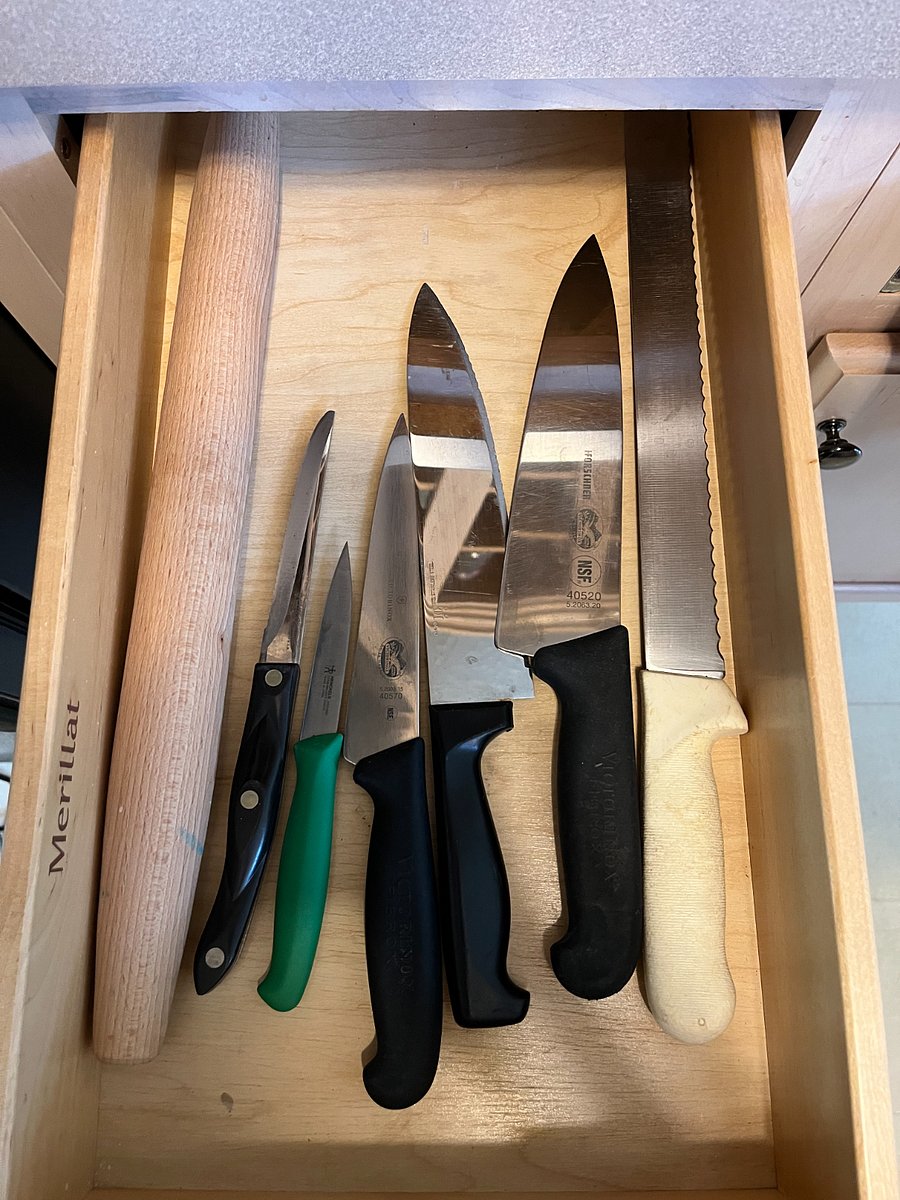 full assortment of kitchen knives and other utensils