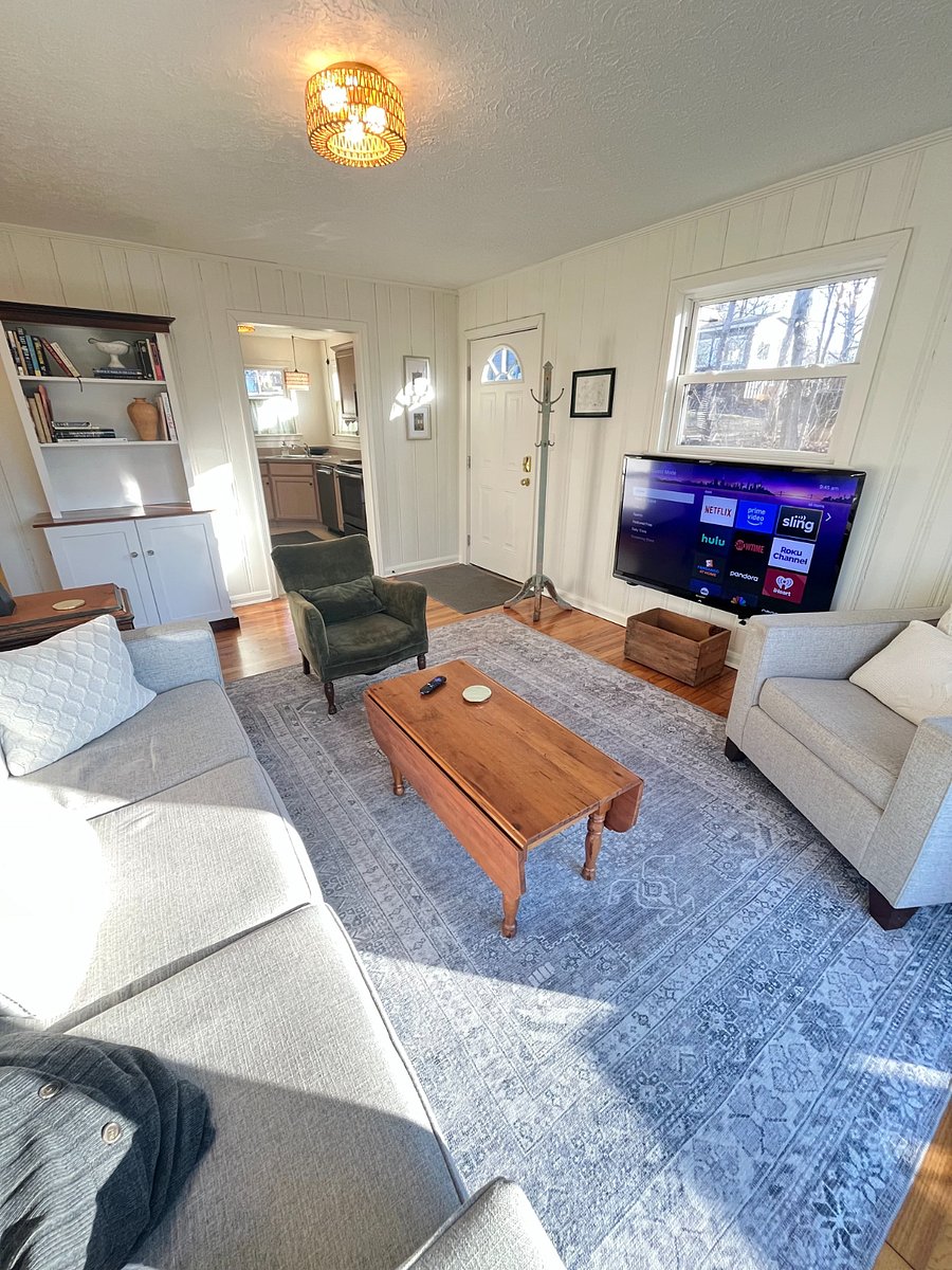 living room with 64" Roku tv and view into kitchen
