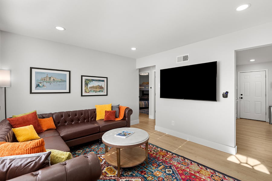 Main living area with oversized TV with Roku streaming