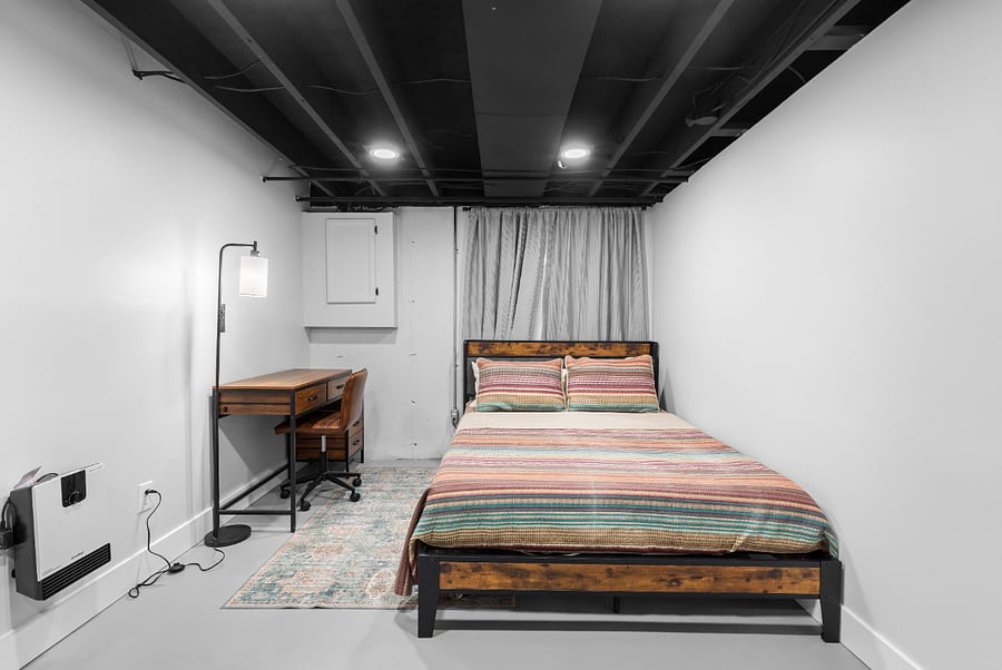 Queen bedroom with 12 inch foam top mattress and workspace
