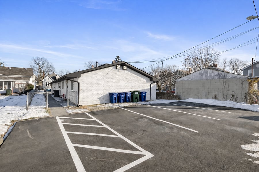 Dedicated off-street parking pad behind the unit.