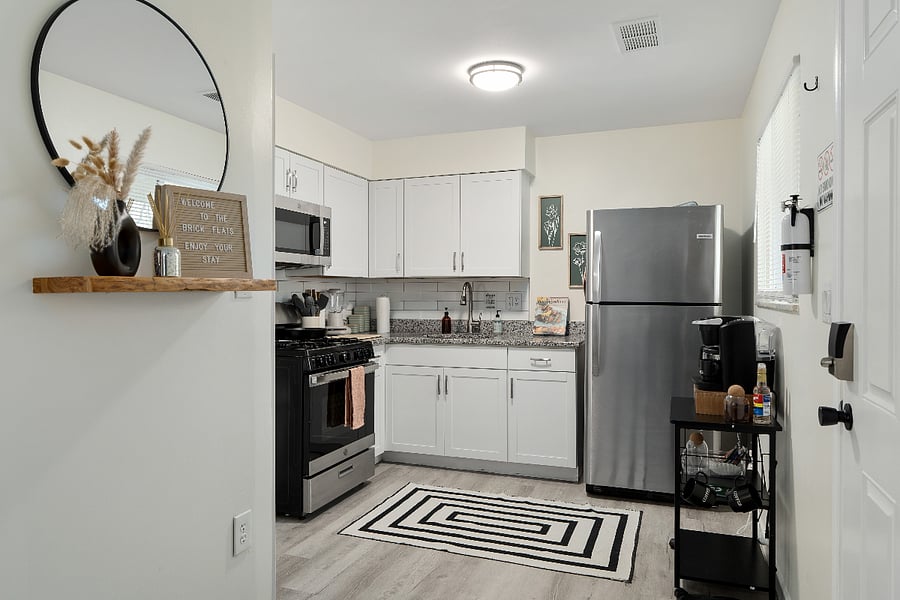 Clean, fully stocked kitchen with stainless appliances and a coffee station to keep you fueled.