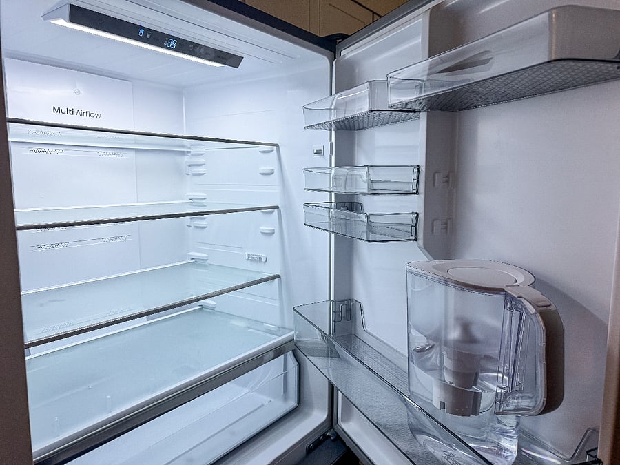 Full-size refrigerator stocked with a Brita water filter.