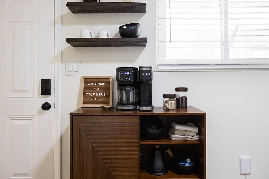 Coffee station with Keurig, pods, and essentials provided.