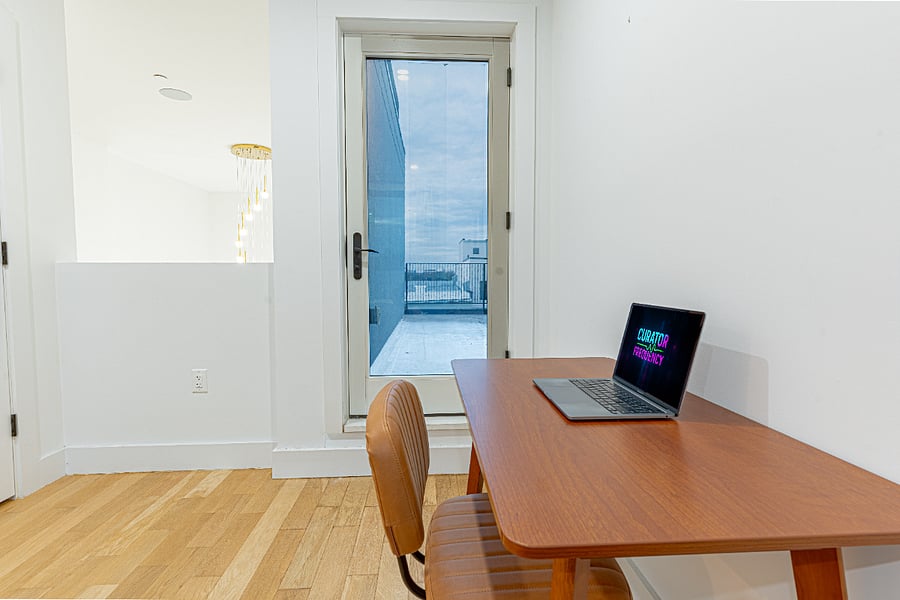 Bedroom + desk + skyline lighta calm setup for sleep and productivity in one.