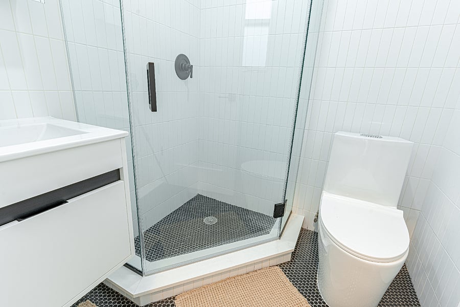 Modern walk-in shower with clean tilefresh, updated, and hotel-like.