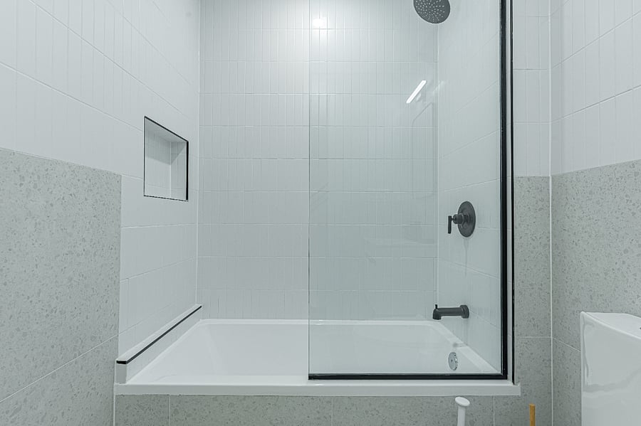 Modern full bathroom with tiled shower and tubclean, bright, and recently renovated.