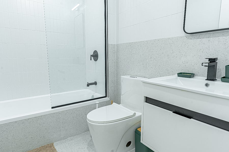 Modern full bathroom with tiled shower and tubclean, bright, and recently renovated.