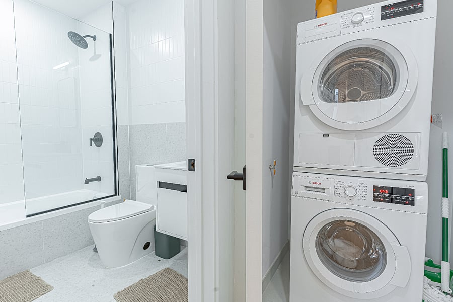 In-unit washer & dryer stackrare Brooklyn convenience for extended stays.