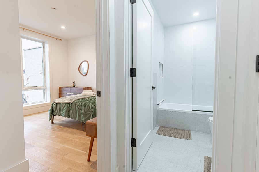 Primary bedroom entry vieweasy flow with nearby bathroom and storage.