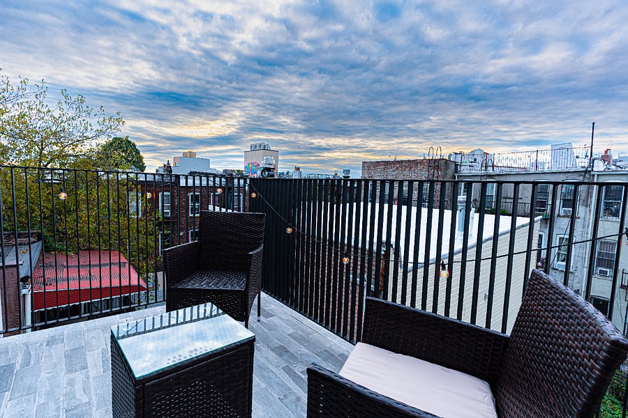 Private rooftop patio / terrace with seatingperfect for coffee, reading, or evening sunsets.