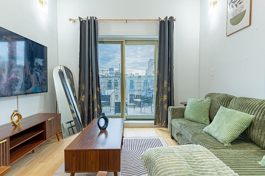 Living room with large windowsbright, airy, and welcoming.