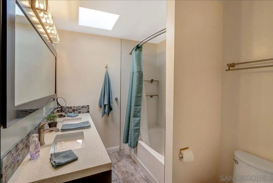 Large tub + shower with dual vanities - plenty of storage.