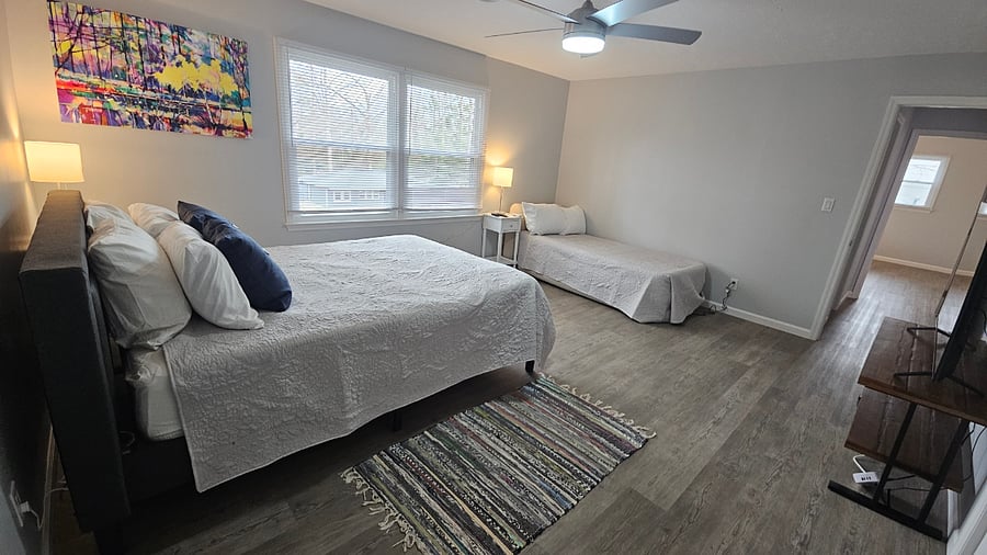 Primary bed - large enough for additional bed that can be set up if the tenant needs it