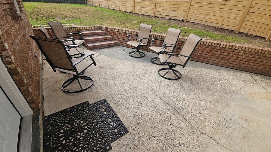 Patio - 6 swivel chairs creates a seamless indoor-outdoor entertaining area. Brick wall & stairs allow seating for 7 more people.
