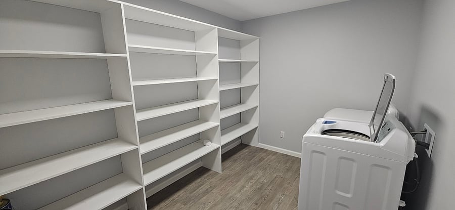 Pantry off of kitchen - washer and dryer - with plenty of shelves