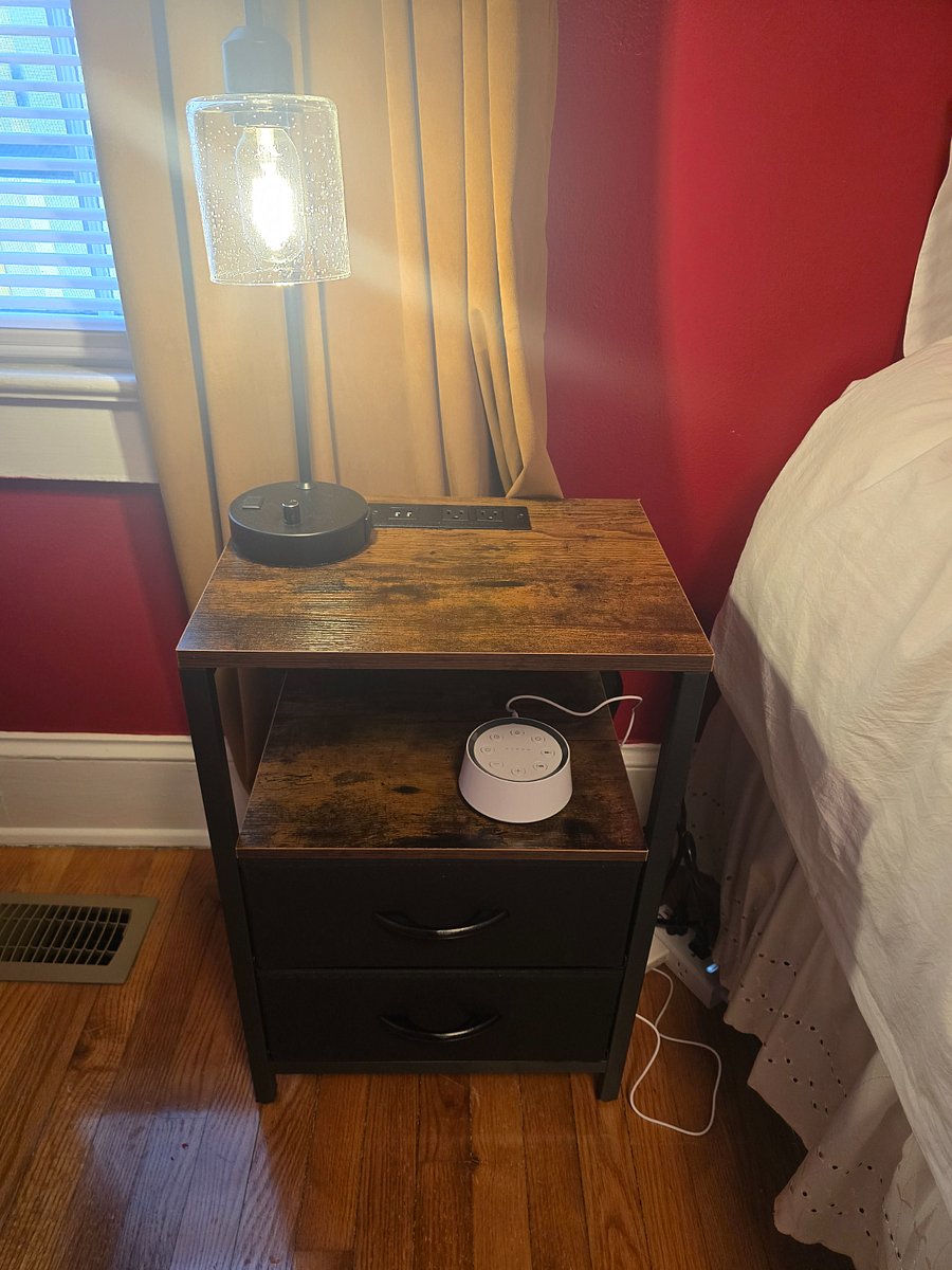 Master bedroom - nightstand with charging station, USB port and outlets, storage shelf. Table lamp with with USB A and C ports and outlet. With noise machine.