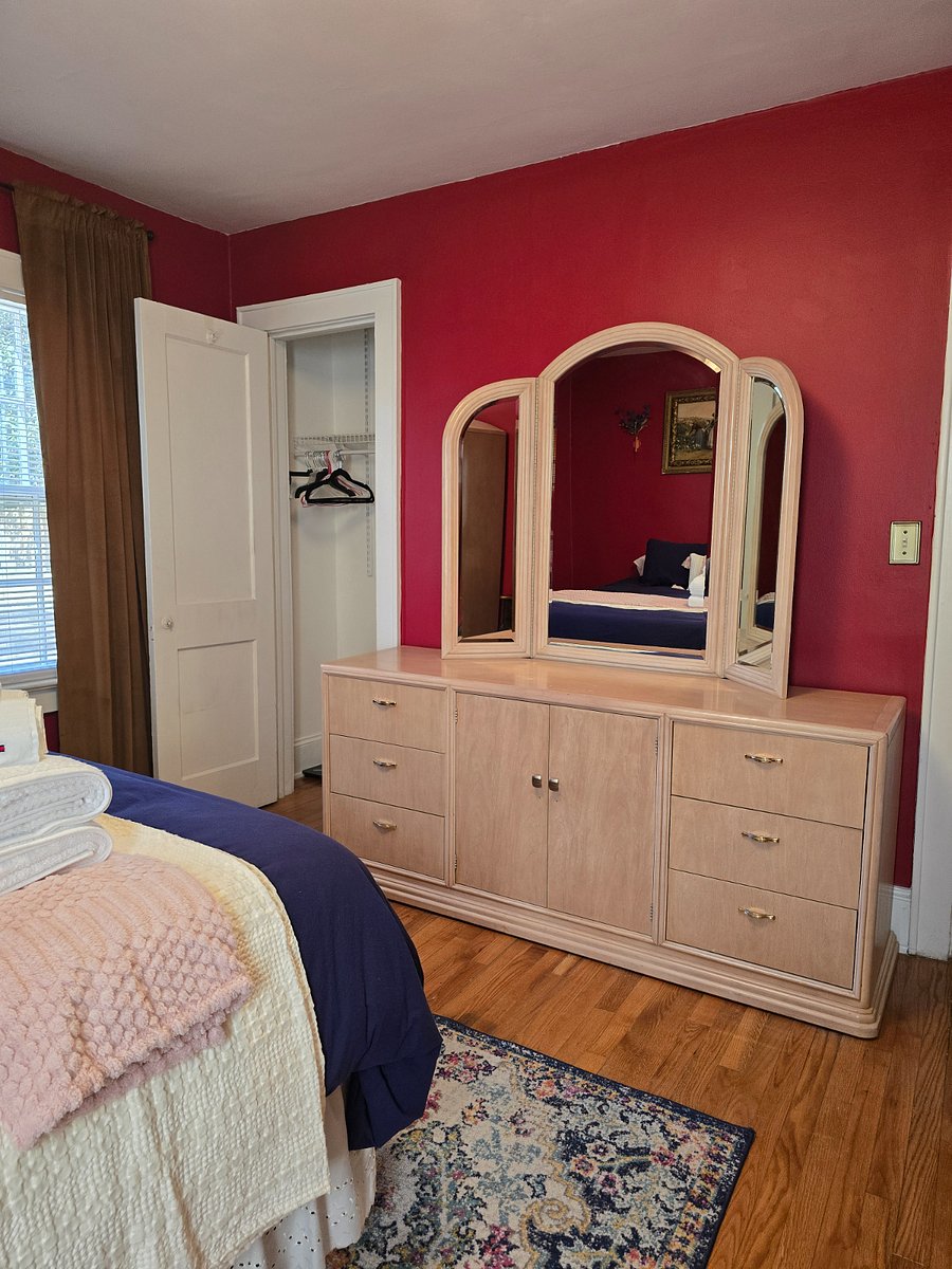Master bedroom - full sized dresser and mirror adjacent to closet