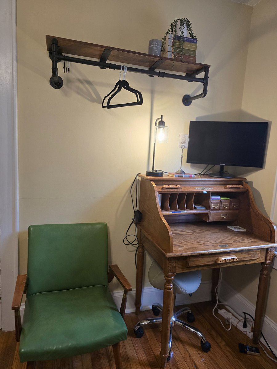 2nd bedroom - work station for the WFH guests. Monitor, table lamp with with USB A and C ports and outlet, and surge protector. Extra space for hanging