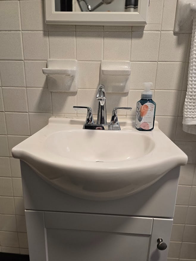 Bathroom - sink; hair dryer below