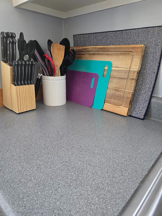 Kitchen - drying mat, various cutting boards, kitchen utensils, and steak knife set