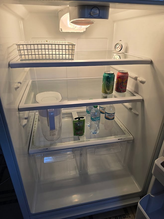 Kitchen - refrigerator with bottled water, sparkling water, and Brita filtered water pitcher
