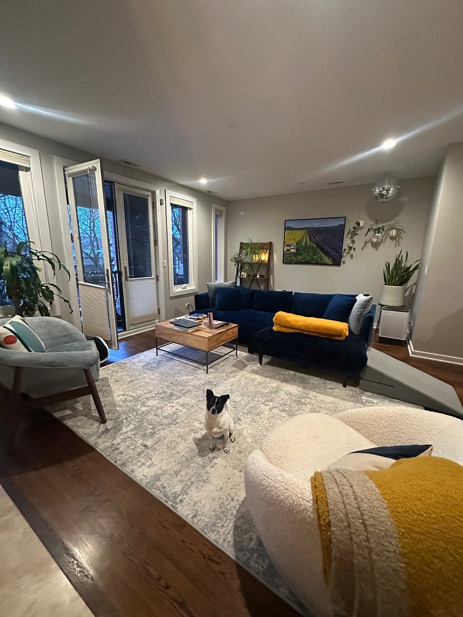 Shared living room + Murphy! Exterior balcony access to the left.