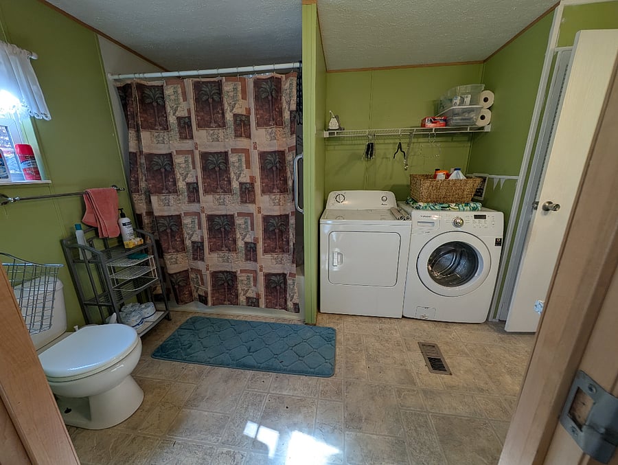 large masterbath/laundry room off of master bdrm and kitchen