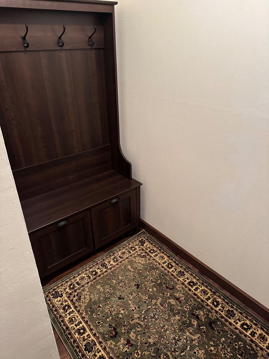 Entering the door, steps up to the left.