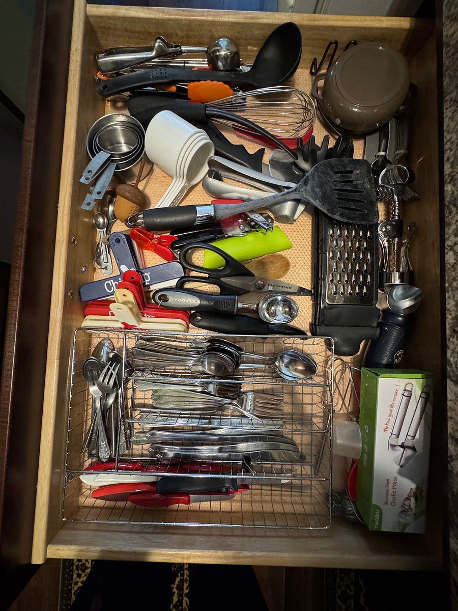Fully loaded kitchen cupboards and drawers.