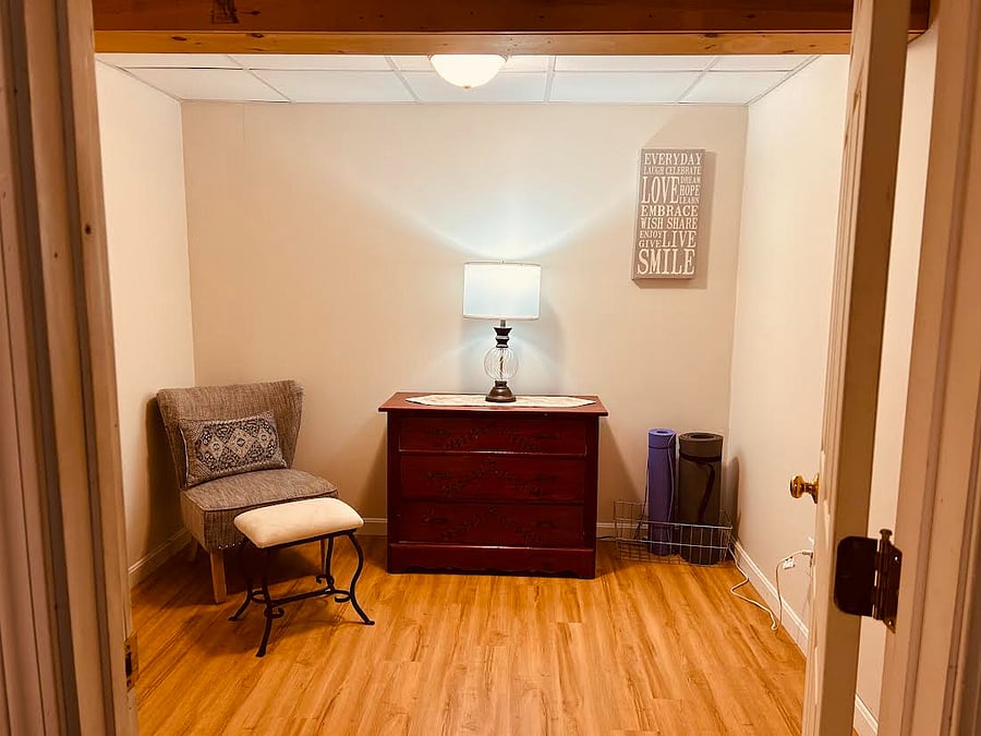 This cozy nook is a bonus room in the bedroom. Offering space to relax or work at your leisure.